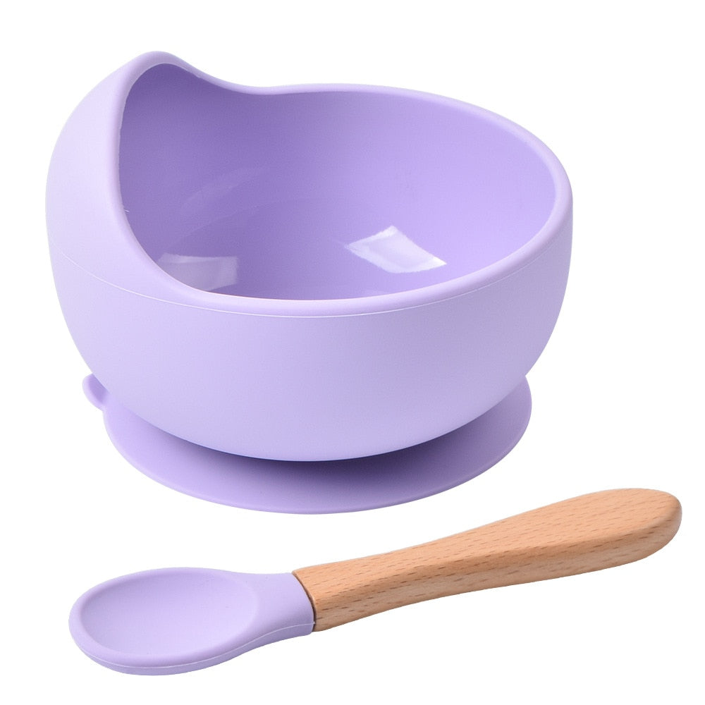 Feeding bowl outlet with spoon